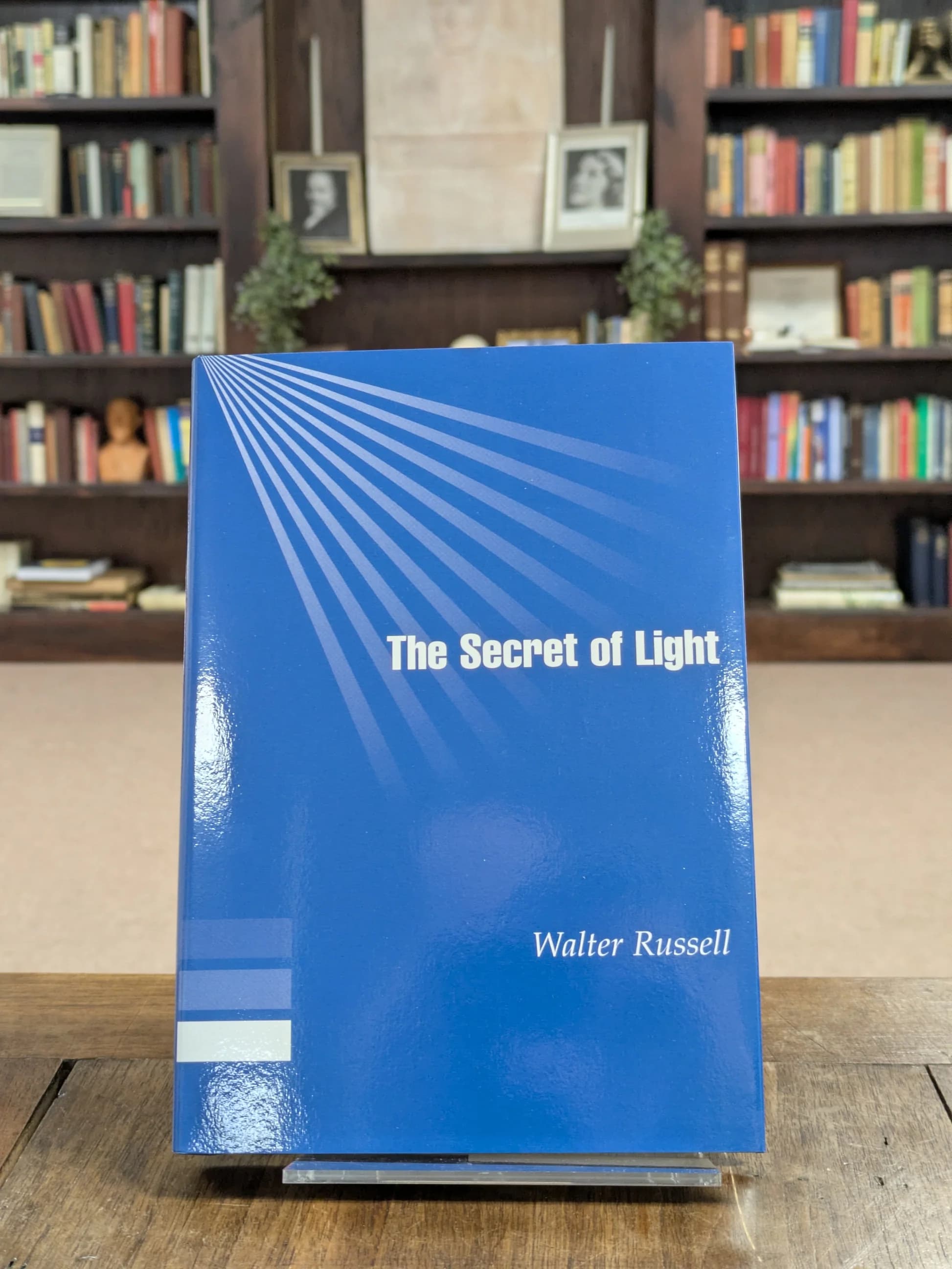 A copy of The Secret of Light displayed in an archive library